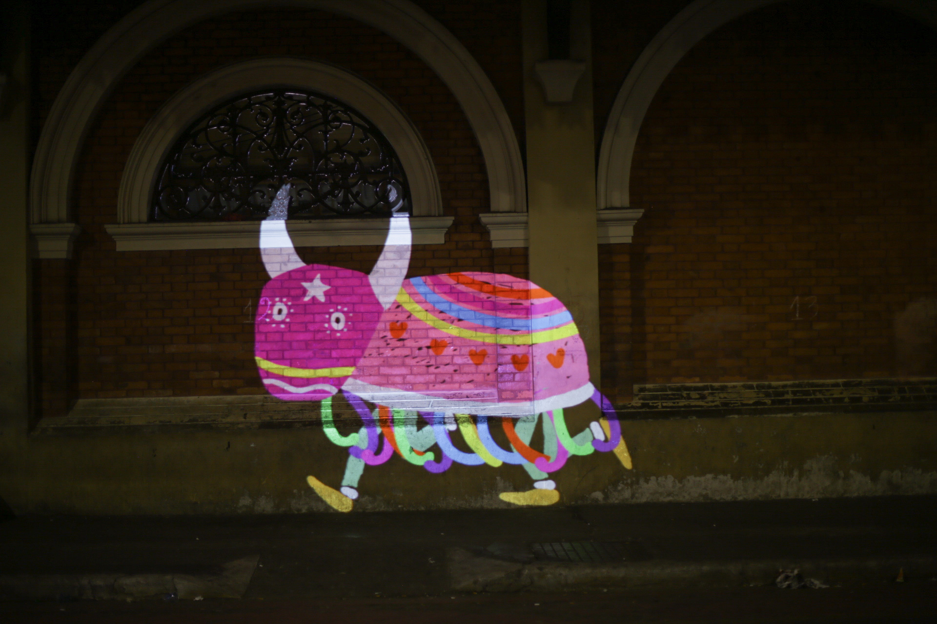 VJ Suave Suaveciclo conducting mobile projection mapping of Bumba meu boi, a folk lore magical creature